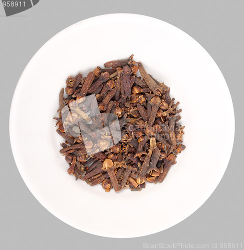 Image of Heap of clove on white plate