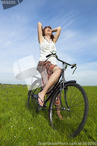 Image of Girl with a bicycle