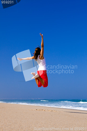 Image of Young woman jumping