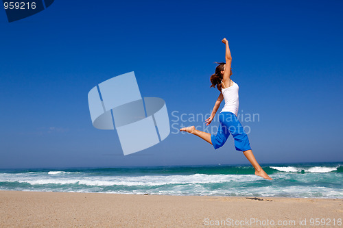 Image of Young woman jumping