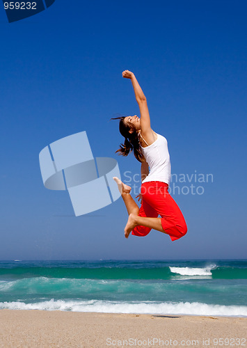 Image of Young woman jumping