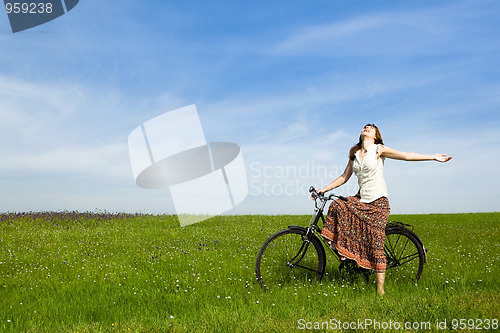 Image of Girl with a bicycle