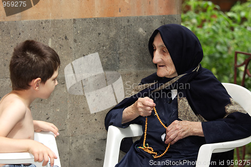 Image of Kid chatting with granny
