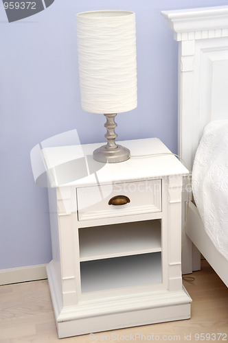 Image of Bedside table with lamp