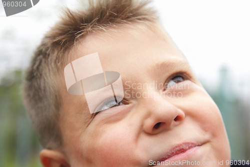 Image of Boy looking to sky closeup