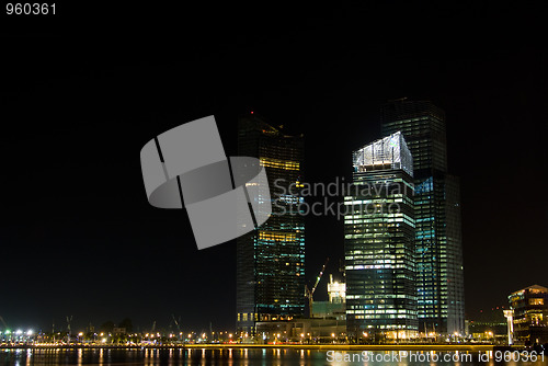 Image of High-rise buildings at night in Singapore
