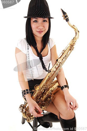 Image of Chinese girl playing the saxophone.