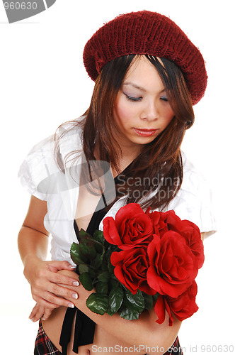 Image of Chinese girl kneeling in black dress.