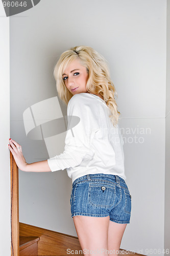 Image of young woman going up the stairs