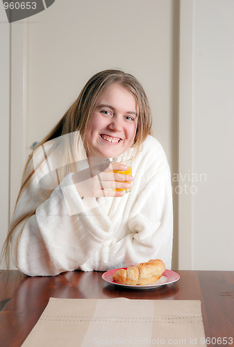 Image of young woman having breakfast