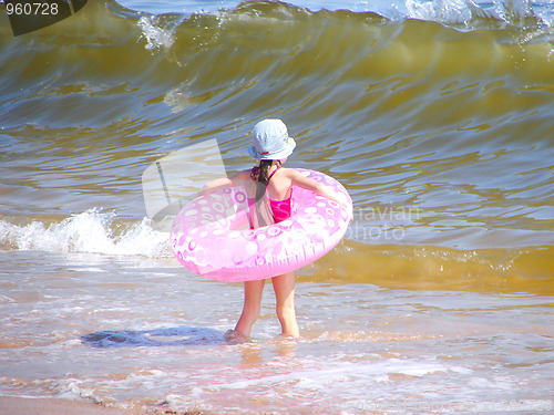 Image of little girl and big wave