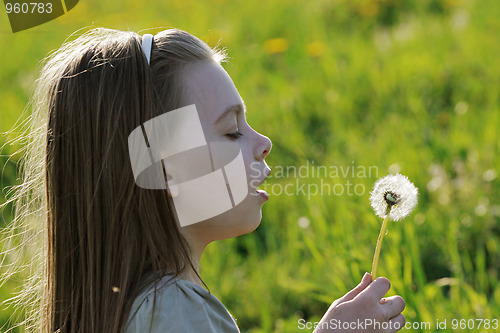 Image of Young girl in summer day.