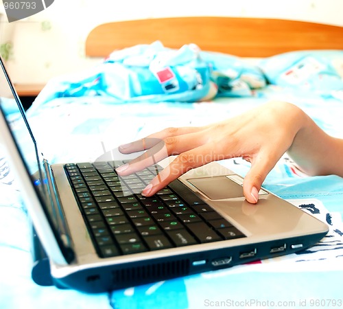 Image of Female hands typing on a laptop