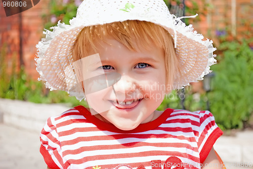 Image of Portrait of a young girl in a white hat