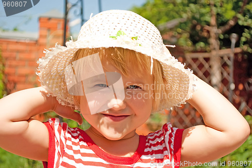 Image of Portrait of a young girl in a white hat