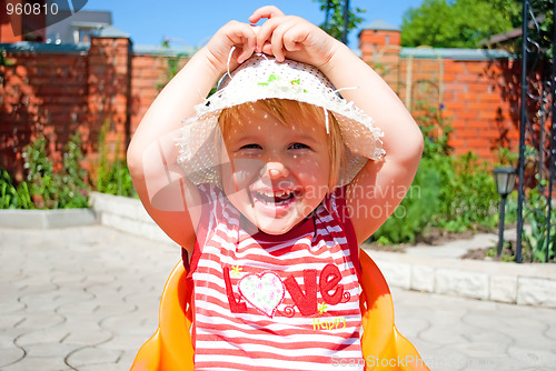 Image of Portrait of a young girl in a white hat