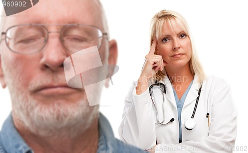 Image of Concerned Senior Man and Female Doctor Behind