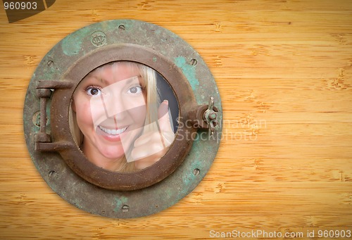 Image of Antique Porthole on Bamboo Wall, Woman with Thumbs Up Looking