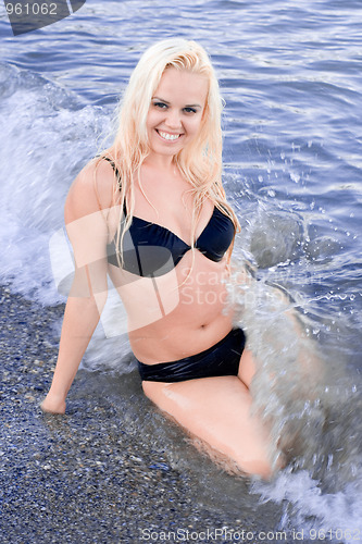 Image of woman sitting in water