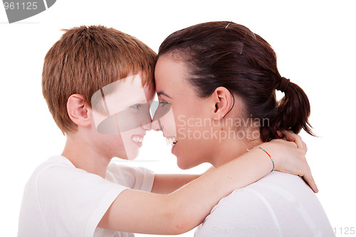 Image of mother and son embracing cheek to cheek 