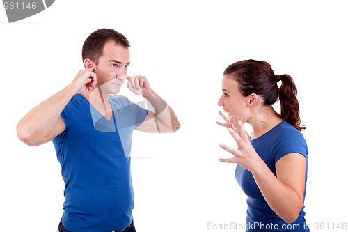 Image of woman screaming with a man, him with hands covering his ears 