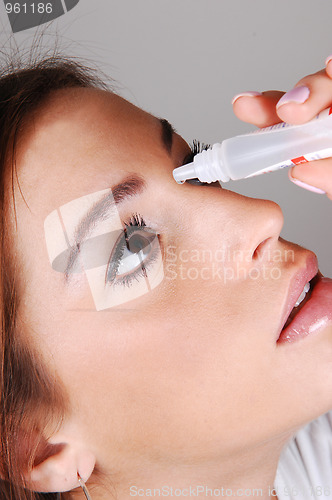 Image of Woman with eyedrops.