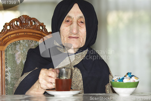 Image of Elderly woman with tea