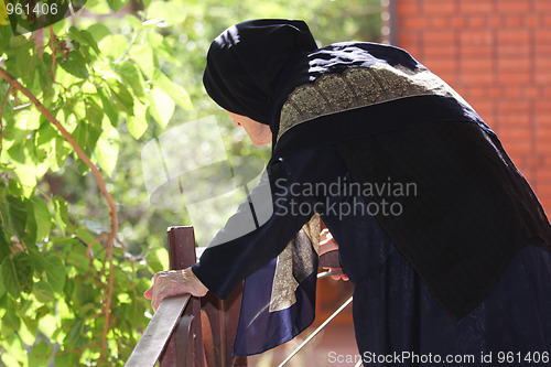 Image of Elderly woman looking down