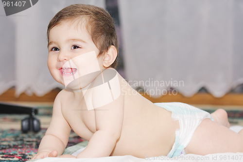 Image of Smiling infant on floor