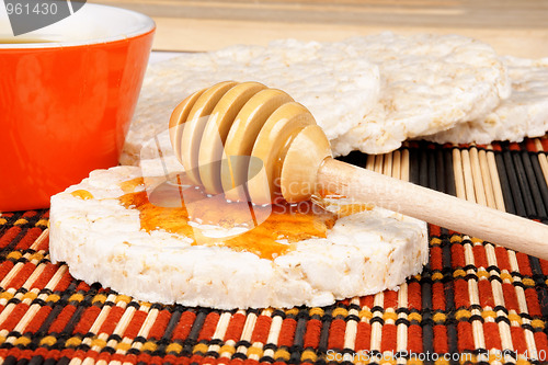 Image of Honey dipper on a rice cake