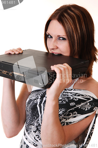 Image of A young girl angry at her laptop.