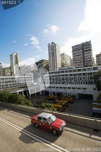 Image of taxi passing the road in city