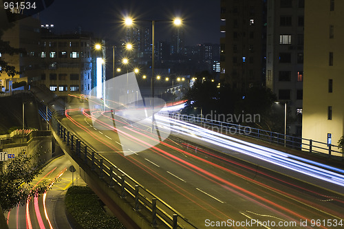 Image of traffic bridge at night