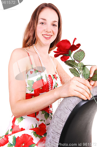 Image of Pretty girl in dress with rose.