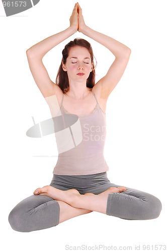 Image of Young woman doing yoga.