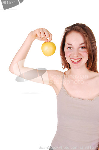 Image of Young girl holding up apple.