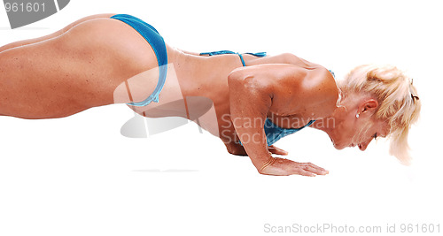 Image of Woman doing pushups.