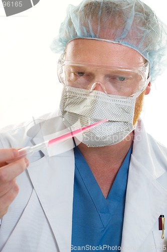 Image of Man holding a pipette