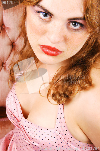 Image of Pretty girl on sofa.