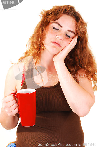Image of Sleeping girl with coffee.
