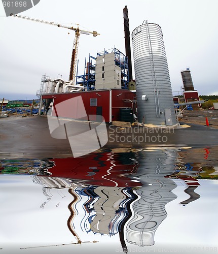 Image of construction site, new bio fuel power plant  with reflection