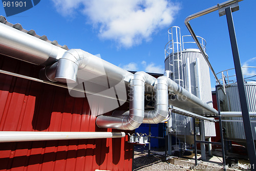 Image of Industrial zone, Steel pipelines against blue sky        