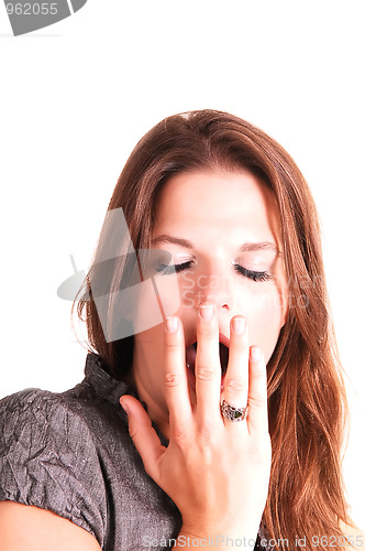 Image of Young woman yawning.