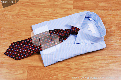 Image of Blue dress shirt with tie.