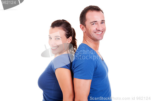 Image of couple  back to back smiling,