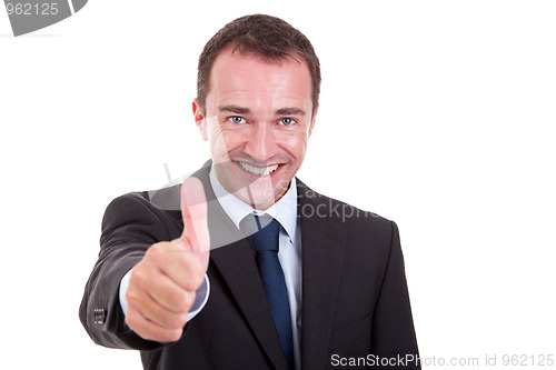 Image of handsome businessman with thumb raised as a sign of success