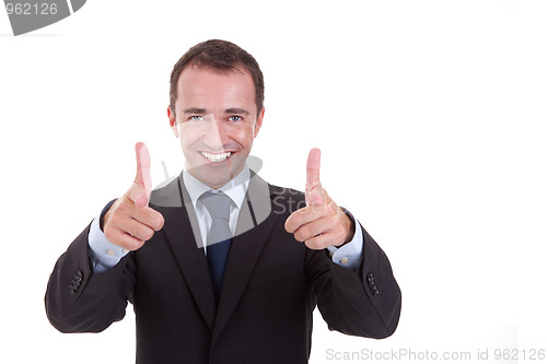 Image of Young businessman with thumb raised as a sign of success