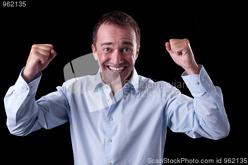 Image of Portrait of a very happy  businessman with his arms raised