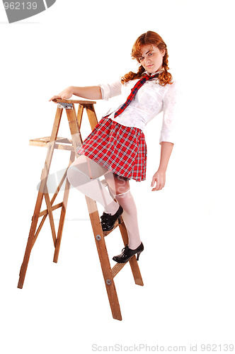 Image of Schoolgirl on stepladder.