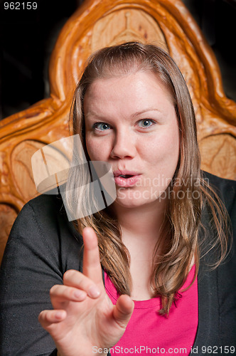 Image of Pretty young woman telling a story